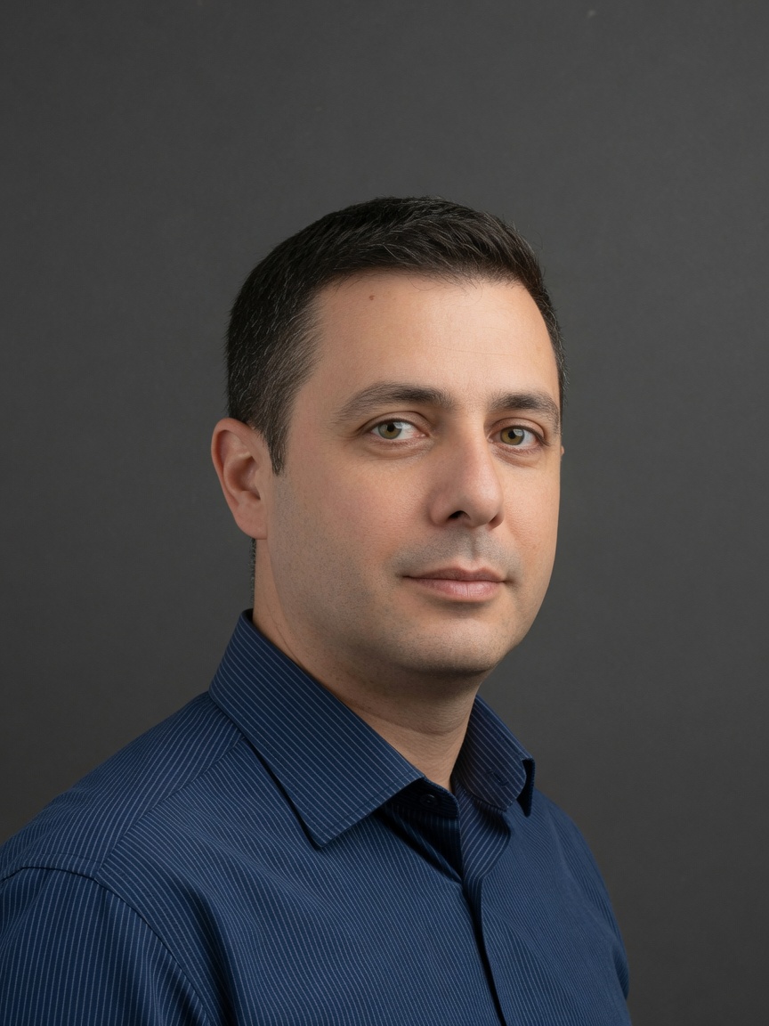 Studio headshot on a dark backdrop